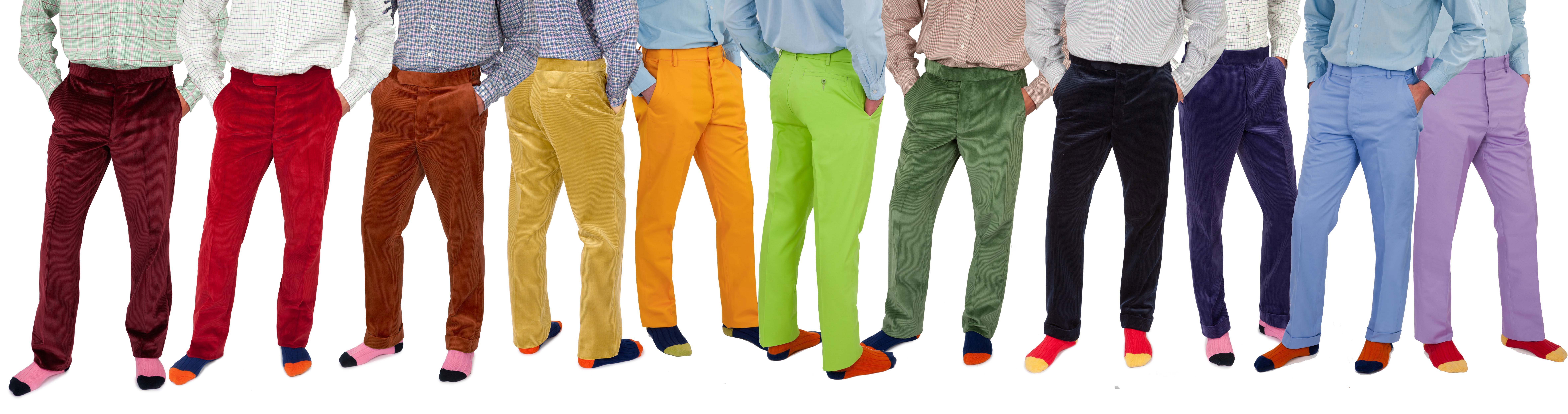 a row of legs dressed in colourful Cordings trousers including mauve , red, brown, cream, orange, green, mint green, navy blue, purple, baby blue and lilac. 